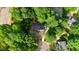 Aerial view of the property showcasing its location amidst lush greenery and neighborhood streets at 1609 Falls Ct, Raleigh, NC 27615
