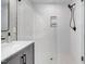 Contemporary shower featuring white subway tile, glass door, and black hardware at 1609 Falls Ct, Raleigh, NC 27615