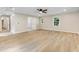 Bright and spacious bonus room with light-colored floors and ample natural light from the many windows at 1609 Falls Ct, Raleigh, NC 27615