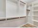 Bright closet with custom shelving and multiple rods for maximum storage and organization at 1609 Falls Ct, Raleigh, NC 27615
