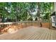 Spacious wood deck perfect for outdoor entertaining overlooking the lush, private backyard at 1609 Falls Ct, Raleigh, NC 27615
