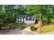 Aerial view of a two-story home with a two-car garage and well-manicured front yard at 1609 Falls Ct, Raleigh, NC 27615