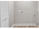 This practical laundry room features access to utilities and a storage closet at 1609 Falls Ct, Raleigh, NC 27615
