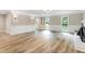 Bright and spacious living room featuring a fireplace, open floor plan, and hardwood floors at 1609 Falls Ct, Raleigh, NC 27615