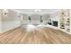 Bright and spacious living room featuring a fireplace, open floor plan, and hardwood floors at 1609 Falls Ct, Raleigh, NC 27615