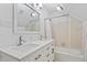 Bathroom featuring double sinks, a tub and shower combination, and modern finishes at 1623 Village Glenn Dr, Raleigh, NC 27612
