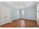Spacious bedroom with hardwood floors, plantation shutters, and double door closet at 1623 Village Glenn Dr, Raleigh, NC 27612