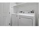 Bright laundry room featuring a front loading washer and dryer at 1623 Village Glenn Dr, Raleigh, NC 27612