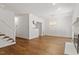 Spacious, white-walled living room with hardwood flooring at 1623 Village Glenn Dr, Raleigh, NC 27612
