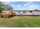Expansive backyard features a wood deck and mature trees, perfect for outdoor gatherings at 168 Hoss Ridge Ln, Dunn, NC 28334