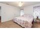 Comfortable bedroom featuring floral bedding, carpet floors, and natural light at 168 Hoss Ridge Ln, Dunn, NC 28334