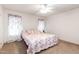 Cozy bedroom featuring floral bedding, carpet floors, and a ceiling fan at 168 Hoss Ridge Ln, Dunn, NC 28334