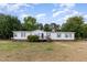 Charming single-story home with a well-maintained lawn and a cozy front porch at 168 Hoss Ridge Ln, Dunn, NC 28334