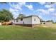 Home's exterior with well-maintained lawn and mature trees offer a serene outdoor setting at 168 Hoss Ridge Ln, Dunn, NC 28334