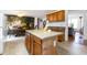 Open kitchen featuring a central island, adjacent dining area, and ample cabinet space at 168 Hoss Ridge Ln, Dunn, NC 28334