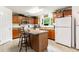 Well-equipped kitchen with plentiful cabinet space, a central island, and natural light at 168 Hoss Ridge Ln, Dunn, NC 28334