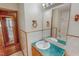 Bathroom featuring white tile, turquoise countertop, and a decorative mirror at 178 Medford Oakley Rd, Rougemont, NC 27572