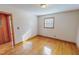 Bedroom featuring hardwood floors, neutral walls, and a doorway at 178 Medford Oakley Rd, Rougemont, NC 27572