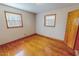 Bedroom featuring hardwood floors, neutral walls, and windows bringing in natural light at 178 Medford Oakley Rd, Rougemont, NC 27572