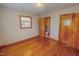 Bedroom with hardwood floors and a view into an ensuite bathroom at 178 Medford Oakley Rd, Rougemont, NC 27572