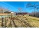 Charming brick home with a carport and a well-maintained front yard under a clear blue sky at 178 Medford Oakley Rd, Rougemont, NC 27572