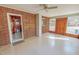 Bright living room boasts brick accent wall and door with large windows for lots of natural light at 178 Medford Oakley Rd, Rougemont, NC 27572