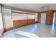 Spacious living room with brick accent and expansive windows, creating a bright and inviting atmosphere at 178 Medford Oakley Rd, Rougemont, NC 27572
