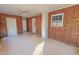 Bright living room features brick accent wall, ceiling fan and a view of outdoor at 178 Medford Oakley Rd, Rougemont, NC 27572