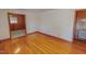 Bright living room featuring hardwood floors and wood trim throughout the home at 178 Medford Oakley Rd, Rougemont, NC 27572