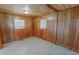 Cozy room featuring wood paneling on the walls and ceiling and flooring at 178 Medford Oakley Rd, Rougemont, NC 27572