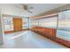 Bright sunroom with lots of windows and a ceiling fan at 178 Medford Oakley Rd, Rougemont, NC 27572