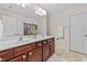Bathroom featuring double sinks with vanity, and decor accents on a tile floor at 1839 Huntley Way, Burlington, NC 27215