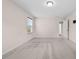 Large bedroom featuring neutral carpeting, natural light, and ample closet space at 1839 Huntley Way, Burlington, NC 27215