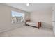 Bright bedroom featuring a wooden twin bed, plush carpet, and a sunlit window with blinds at 1839 Huntley Way, Burlington, NC 27215