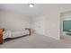Neutral bedroom with twin bed, plush carpet, and double door closet for ample storage at 1839 Huntley Way, Burlington, NC 27215