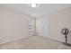 Neutral bedroom with plush carpet, a double door closet, and a window letting in natural light at 1839 Huntley Way, Burlington, NC 27215