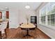 A charming dining room with natural light, a wooden table, and modern decor, creating an ideal setting for meals at 1839 Huntley Way, Burlington, NC 27215