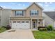 Charming two-story home with a well-manicured lawn and a two-car garage, perfect for families at 1839 Huntley Way, Burlington, NC 27215