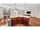 Open-concept kitchen island with granite countertops, perfect for entertaining and casual dining at 1839 Huntley Way, Burlington, NC 27215