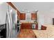 A well-equipped kitchen includes stainless steel appliances, wooden cabinets, granite countertops, and lots of storage at 1839 Huntley Way, Burlington, NC 27215