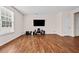 Spacious living room boasts hardwood floors and ample natural light from a large window at 1839 Huntley Way, Burlington, NC 27215