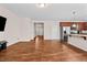 View of the living room leading to the kitchen, complete with stainless steel appliances at 1839 Huntley Way, Burlington, NC 27215