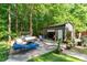 Outdoor living space with comfortable seating, a fire pit, and a shed for storage or hobbies at 2029 Atkins Dr, Raleigh, NC 27610
