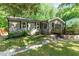 Cozy single story house featuring neutral siding, black shutters, and well-manicured front yard with green grass at 2029 Atkins Dr, Raleigh, NC 27610