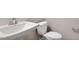 A crisp bathroom features a white sink, toilet, and modern fixtures at 246 Pretty Run Branch Ln, Wendell, NC 27591