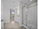 A well-lit bathroom featuring a soaking tub and glass enclosed shower at 246 Pretty Run Branch Ln, Wendell, NC 27591