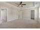 A spacious Primary bedroom features plush carpeting and a ceiling fan at 246 Pretty Run Branch Ln, Wendell, NC 27591