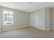 Bedroom featuring neutral walls, carpet flooring, a window, and a closet for ample storage at 246 Pretty Run Branch Ln, Wendell, NC 27591