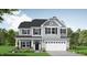 Charming two-story home with a two car garage, covered porch, gray siding, and black shutters at 246 Pretty Run Branch Ln, Wendell, NC 27591