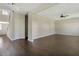 Open-concept living room features hardwood floors, a ceiling fan, and bright natural light at 246 Pretty Run Branch Ln, Wendell, NC 27591
